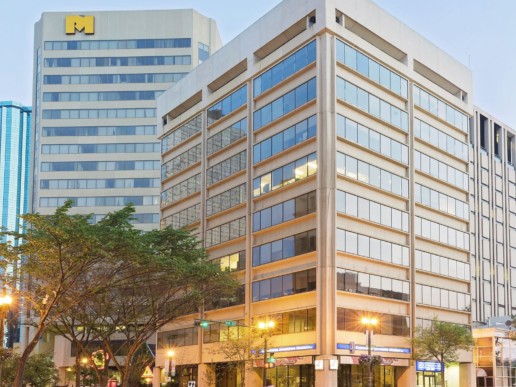 Downtown lights shine on 100 St Place, a great office location central to downtown Edmonton