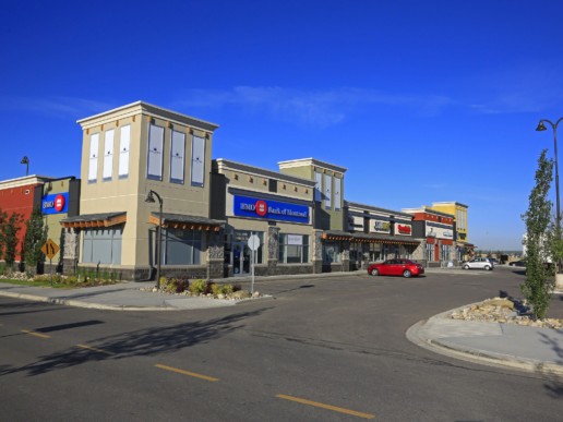 Bright blue sky and parking lot at the Kingsview Market, shopping retail centre and hub for Airdrie, Alberta.