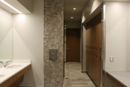 Washroom hallway, with nice interior design for tenant use. Top quality facilities in south Edmonton building of The Village at Blackmud Creek.